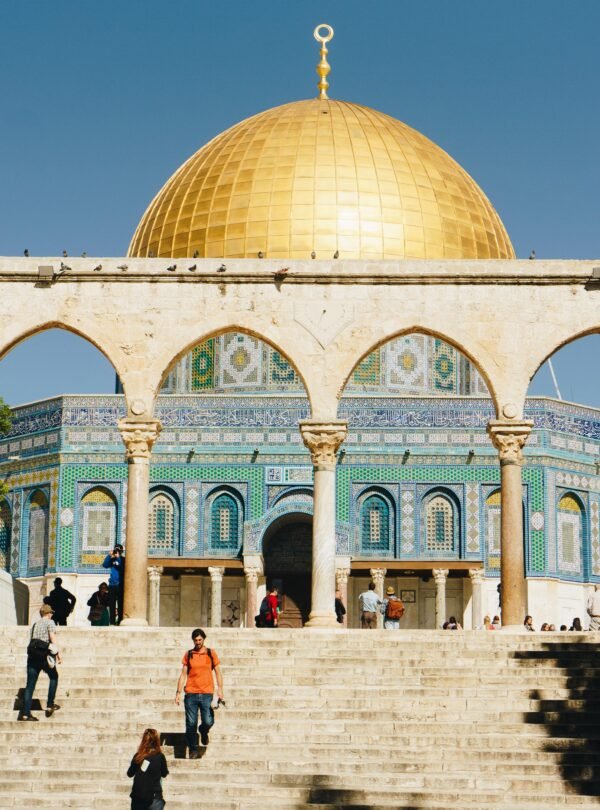 Home Stunning view of the Dome of the Rock in Jerusalem under clear blue skies.